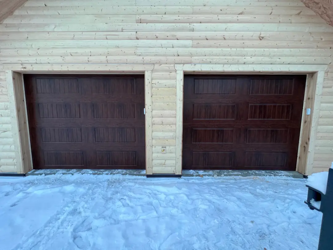 Garage doors and residential exterior from the AK Doors website